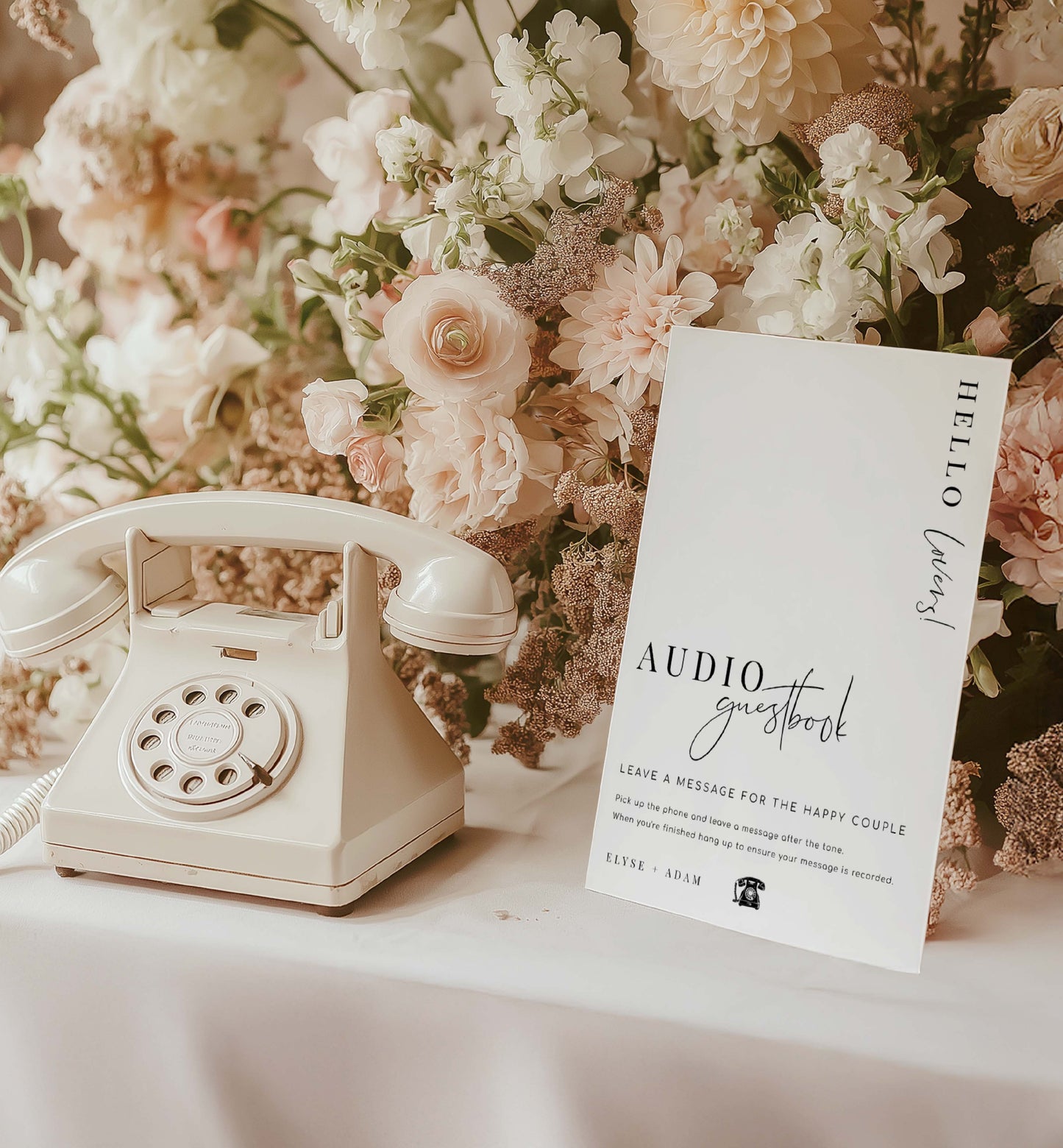 Vintage-style phone and floral arrangement with an audio guestbook card on a white surface. Printable Audio Guestbook Sign, Modern Minimalist Wedding Guestbook Sign, Audio Booth Sign, Phone Message Guest Book Sign, Estelle