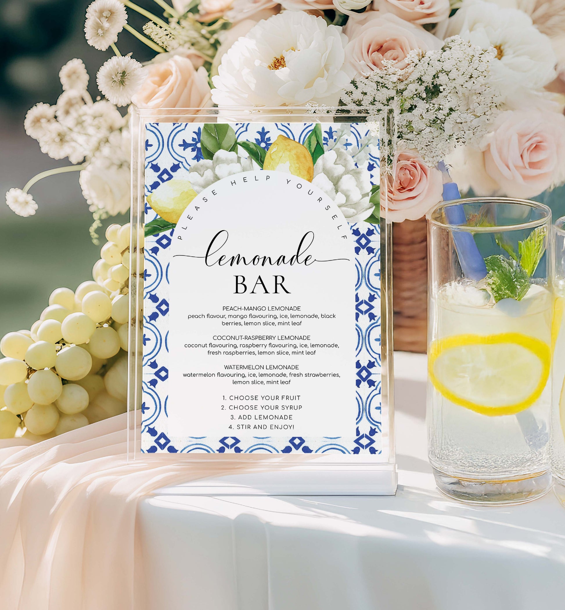 Lemonade bar sign with flowers and a glass of lemonade on a table. Printable Lemonade Bar Sign, Mediterranean Blue Tile Lemons, Editable Drinks Menu Sign, Mocktails Menu Sign, Signature Drinks Sign, The Med