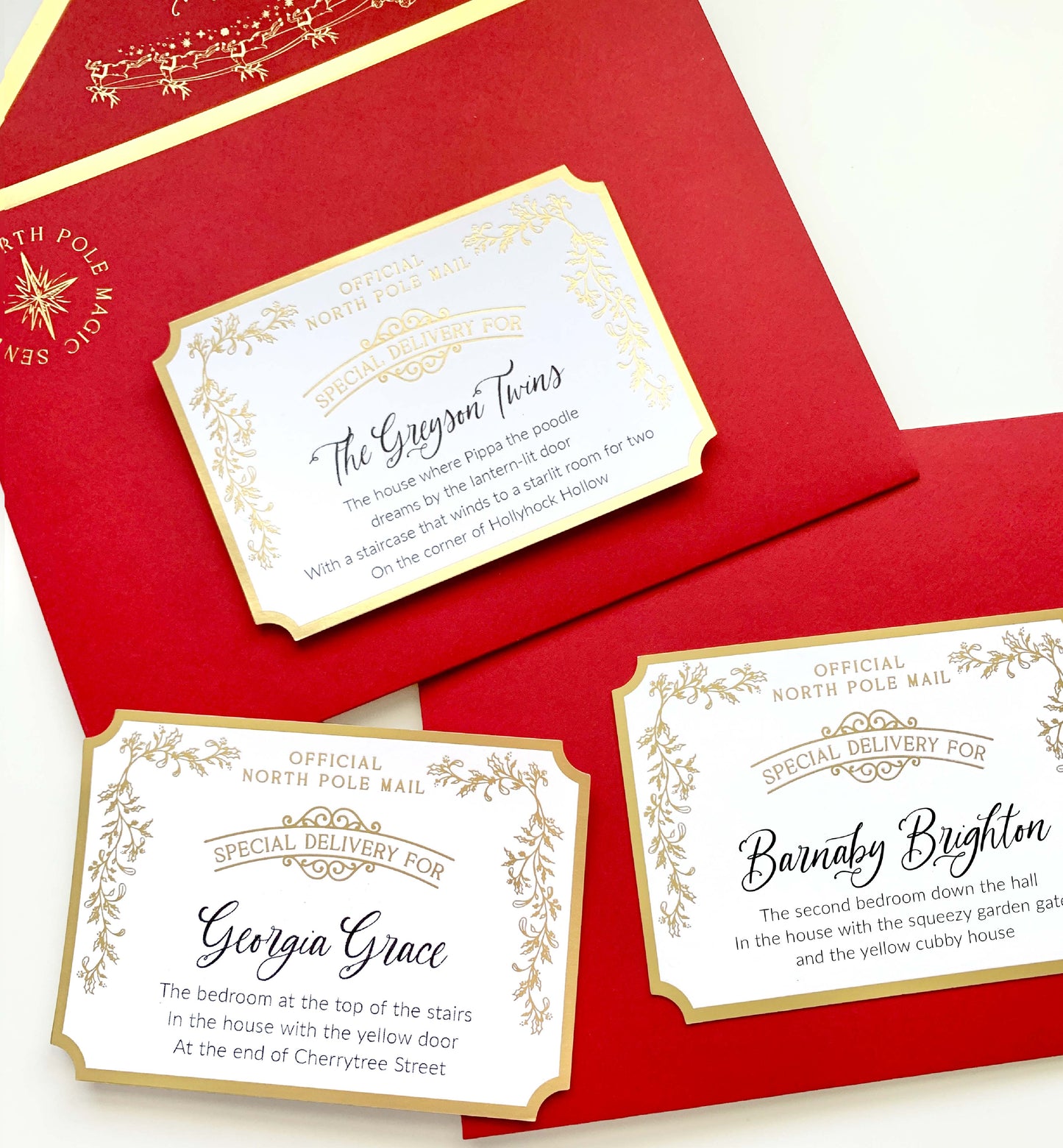 Red envelopes with gold and white labels on a white background. Personalised Letter From Santa Claus, Addressed Envelope and North Pole Postage Stamps, Christmas Eve Box Gift, Christmas Present