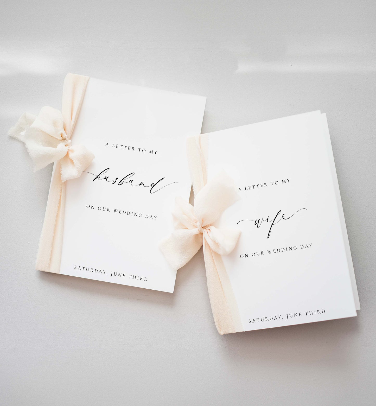 Two wedding day letter books with ribbons on a light gray background. Printable Wedding Vow Books, A Letter To My Husband Wedding Day Card Template, Minimalist Wedding, Bride and Groom Vows Card, Ellesmere