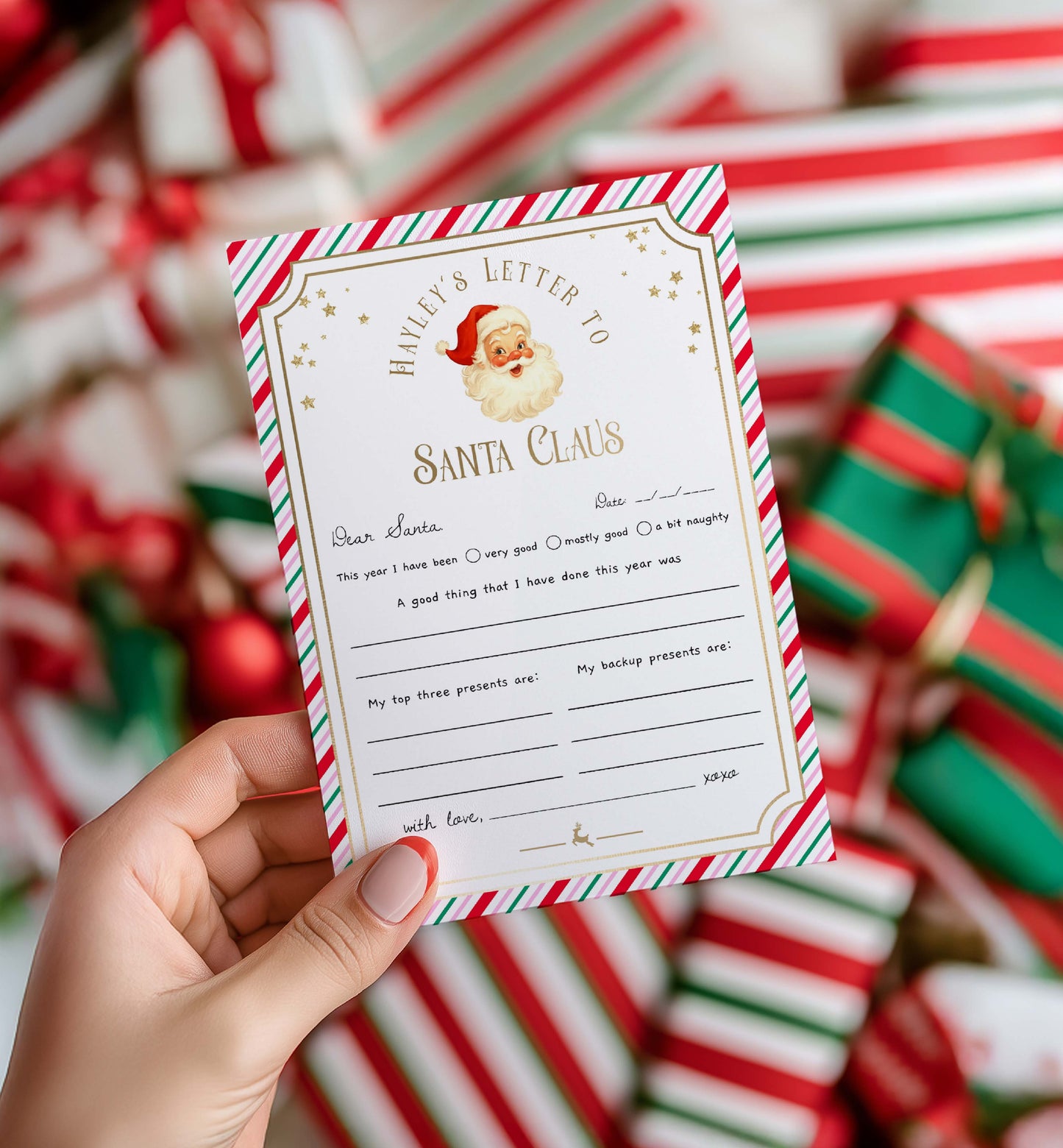 Letter to Santa Claus held by a hand with Christmas presents in the background. Printable Letter To Santa Template, Christmas Eve Mail for Kids, Children's Christmas Wish List, Dear Santa Christmas Letter, Stripe Pink