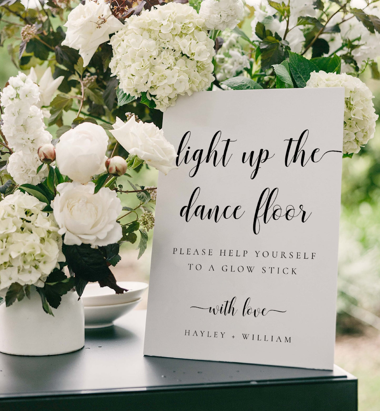 Decorative sign with floral arrangement on a table Printable Wedding Glow Stick Sign, Minimalist Wedding Light Up The Dance Floor Sign, Editable Let Love Glow Sign Template, Leyton