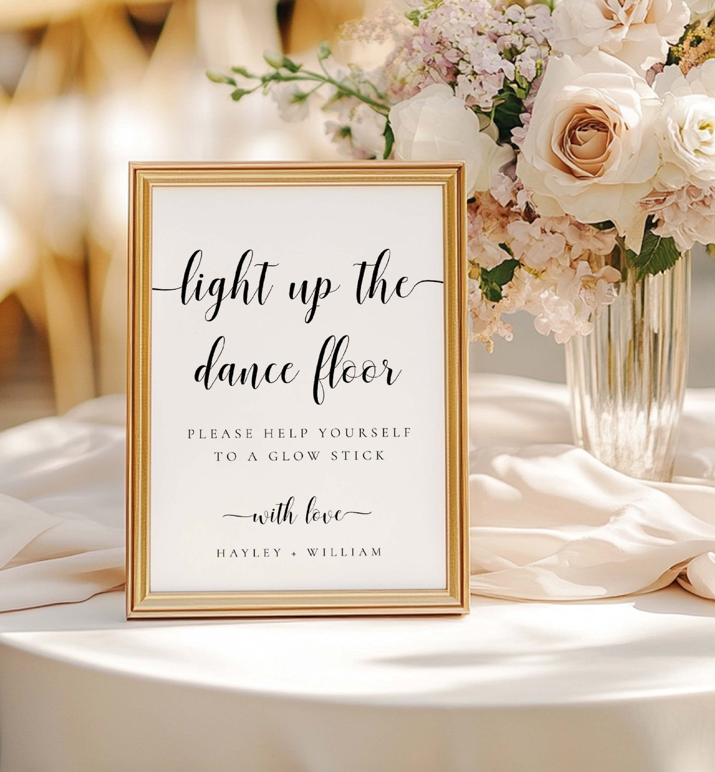 Decorative sign on a table with flowers, text 'light up the dance floor' and 'Please help yourself to a glow stick with love', framed in gold. Printable Wedding Glow Stick Sign, Minimalist Wedding Light Up The Dance Floor Sign, Editable Let Love Glow Sign Template, Leyton