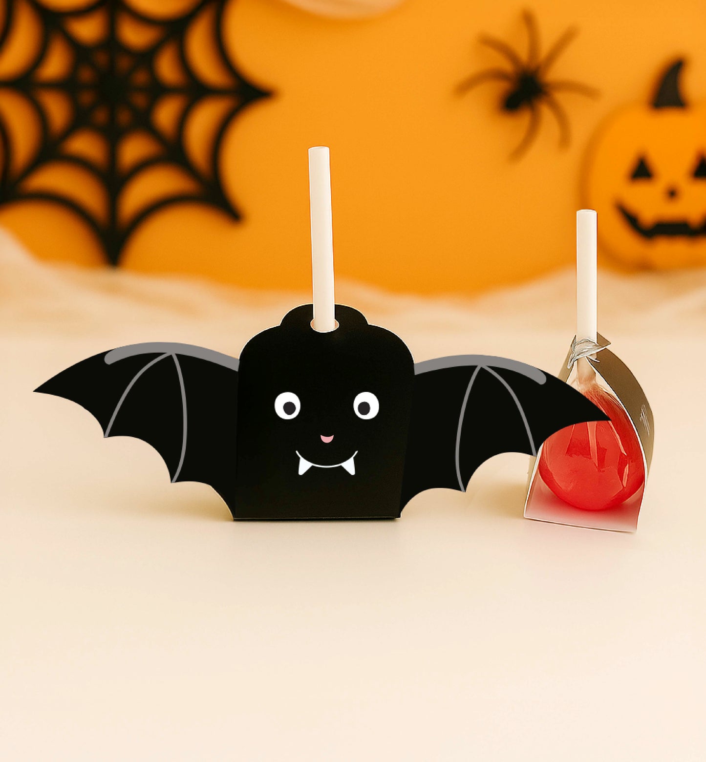 Halloween-themed bat-shaped candy holder with a red liquid on a neutral background. Printable Halloween Lollipop Tags Template, Halloween Trick or Treat Sucker Tag, Kids Classroom Halloween, Friends Halloween Gift