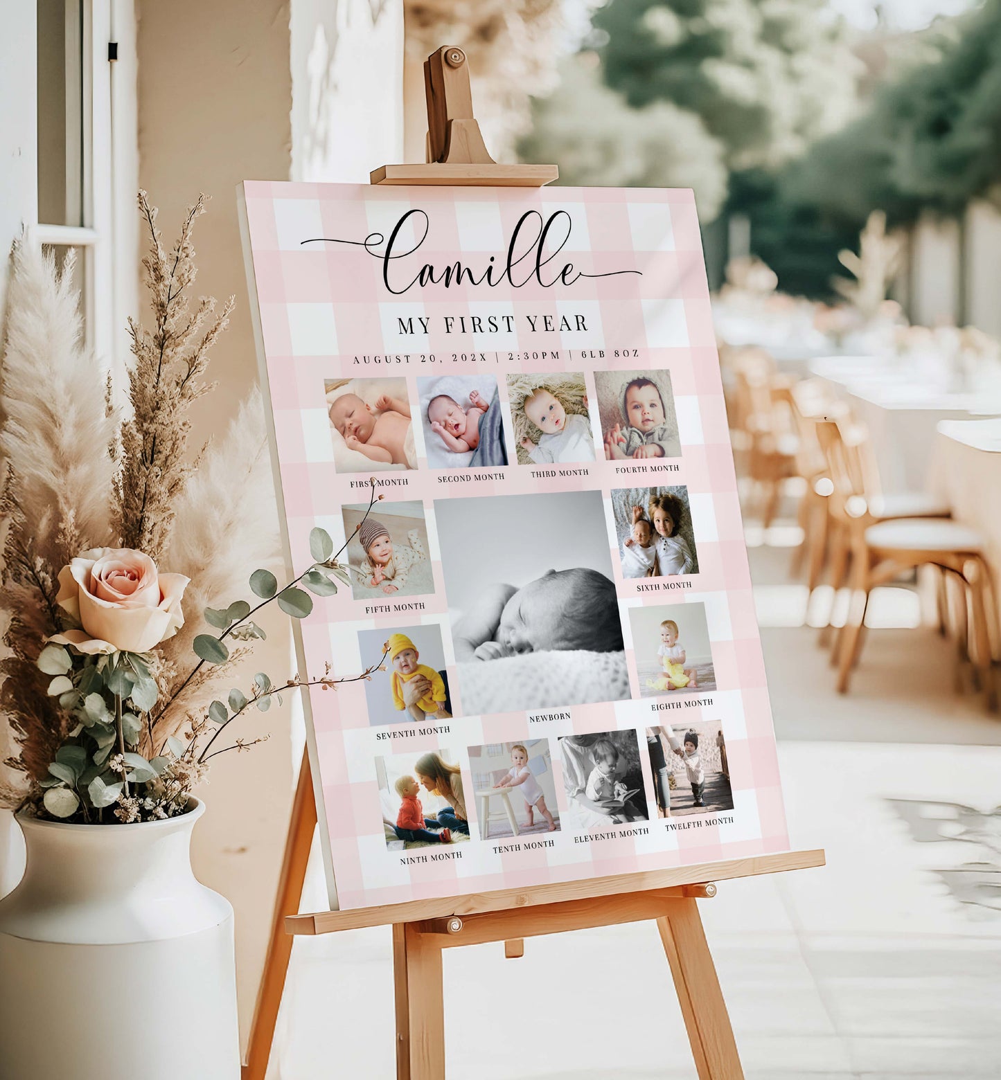 Baby milestone poster titled 'Camille's First Year' displayed on an easel with decorative elements. Printable First Birthday Photo Timeline Sign, Pink Gingham 1st Birthday Photo Banner, First Year Photo Collage Sign, Monthly Milestone Sign,
