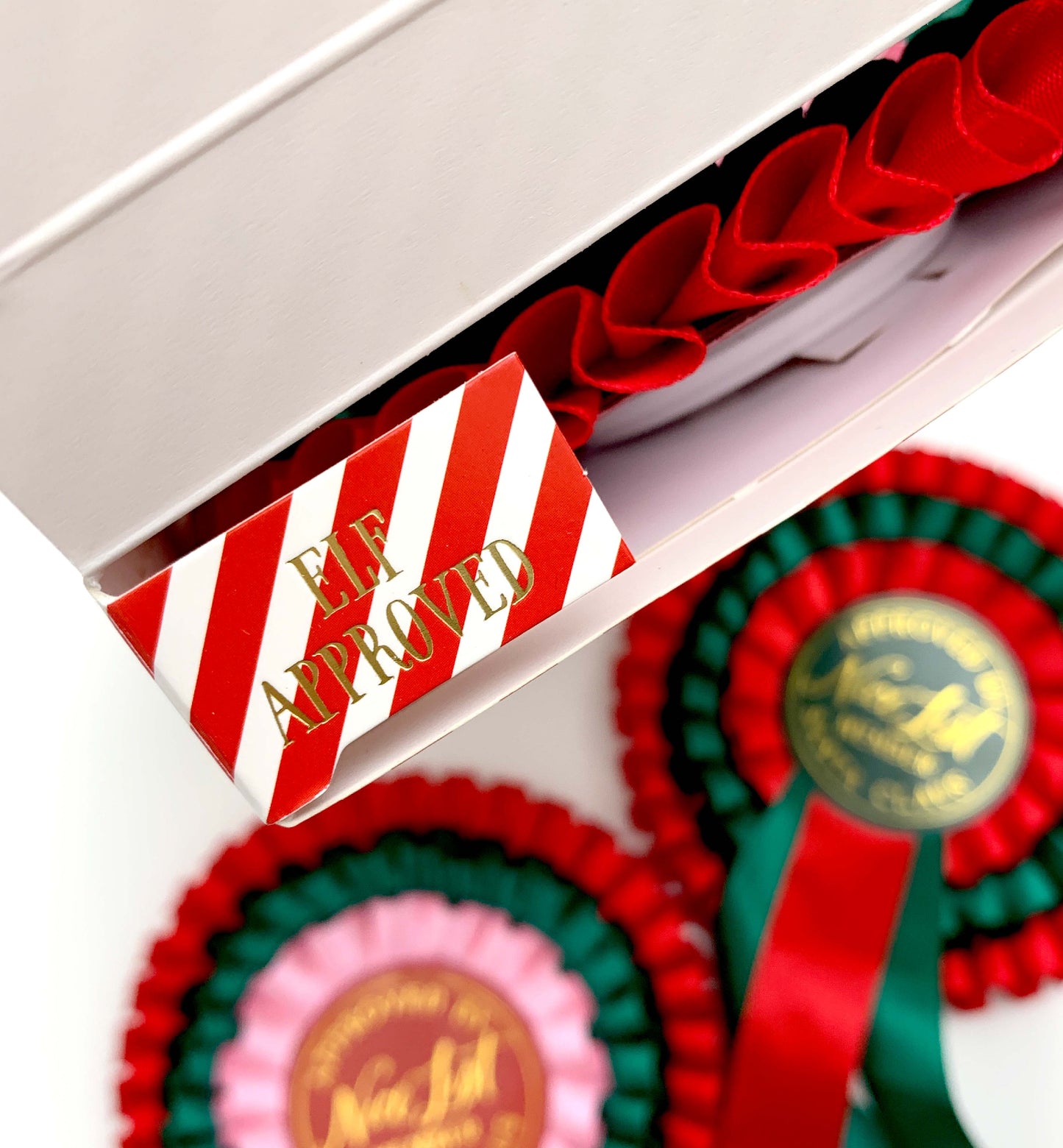 Decorative ribbons with 'Elf Approved' and 'New Girl' text in a box. Nice List Member Rosette Pink Red Green, Christmas Eve Box Gift, Present From Santa Claus, Kids Christmas Gift, Nice List Member Gift