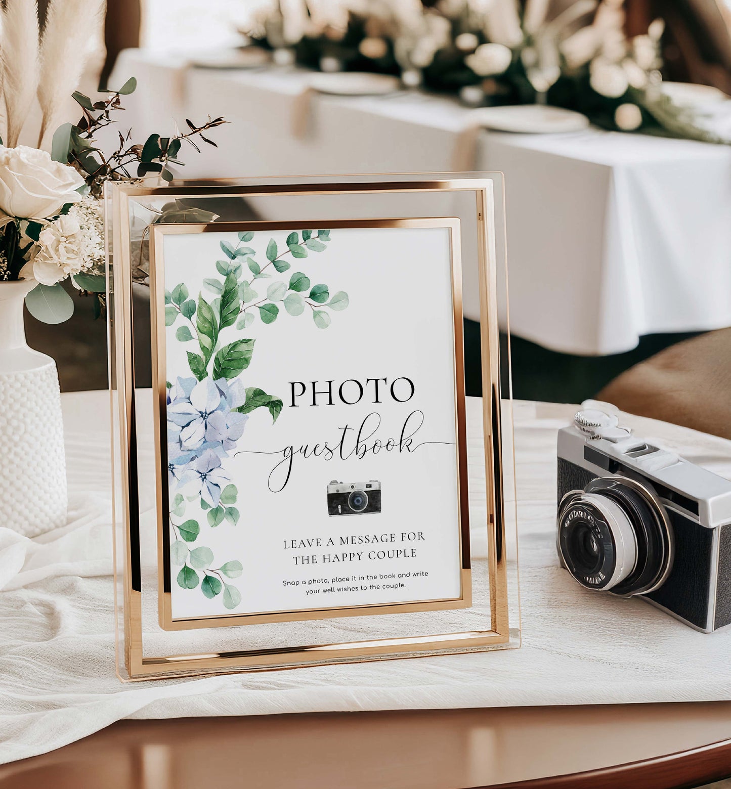Photo guestbook with floral design and vintage camera on a table. Photo Guestbook Sign, Blue Hydrangea Floral, Wedding Guest Book Sign, Polaroid Guest Book Sign, Wedding Keepsake Guestbook Sign, Ferras