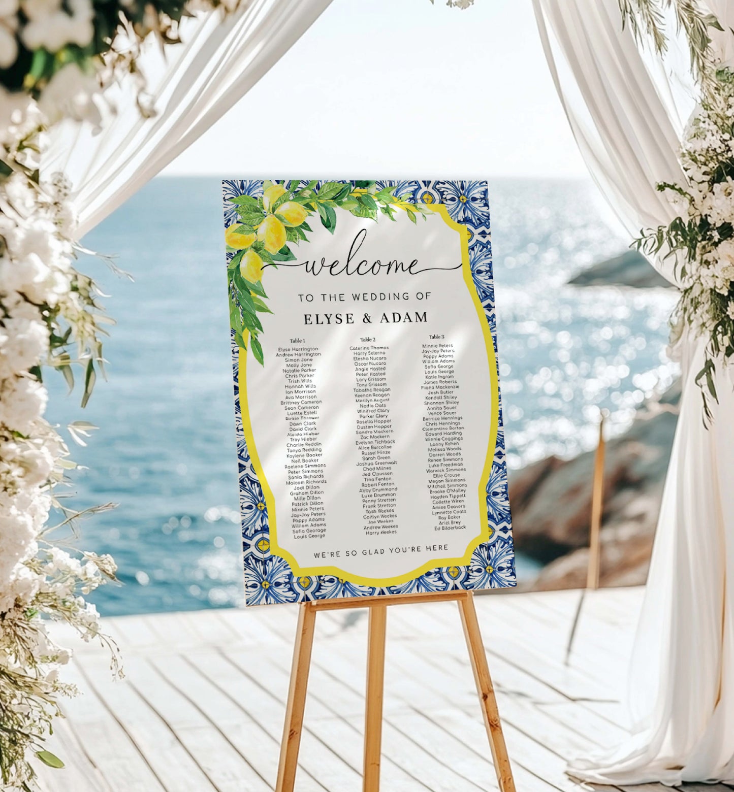 Wedding welcome sign on an easel with a scenic ocean background. Printable 3 Long Tables Wedding Seating Chart Template, Positano Blue Tile Lemon, Seating Table Plan Poster, Reception Seating Sign