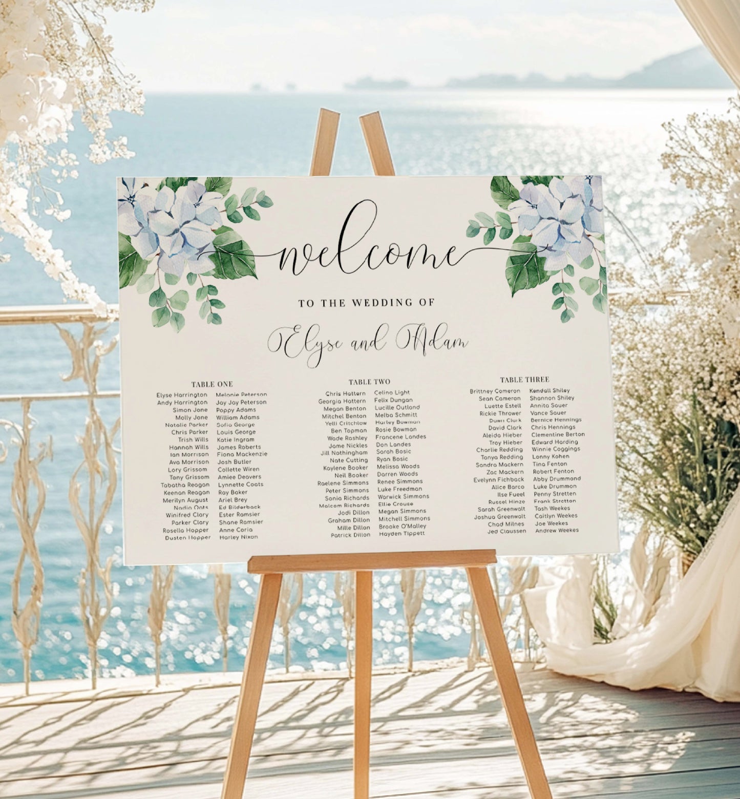 Wedding seating chart on an easel with floral design against a scenic background. Editable Seating Chart, Blue Hydrangea Wedding 3 Banquet Table Plan, Wedding Welcome Sign, Seating Plan Poster, Ferras Blossom
