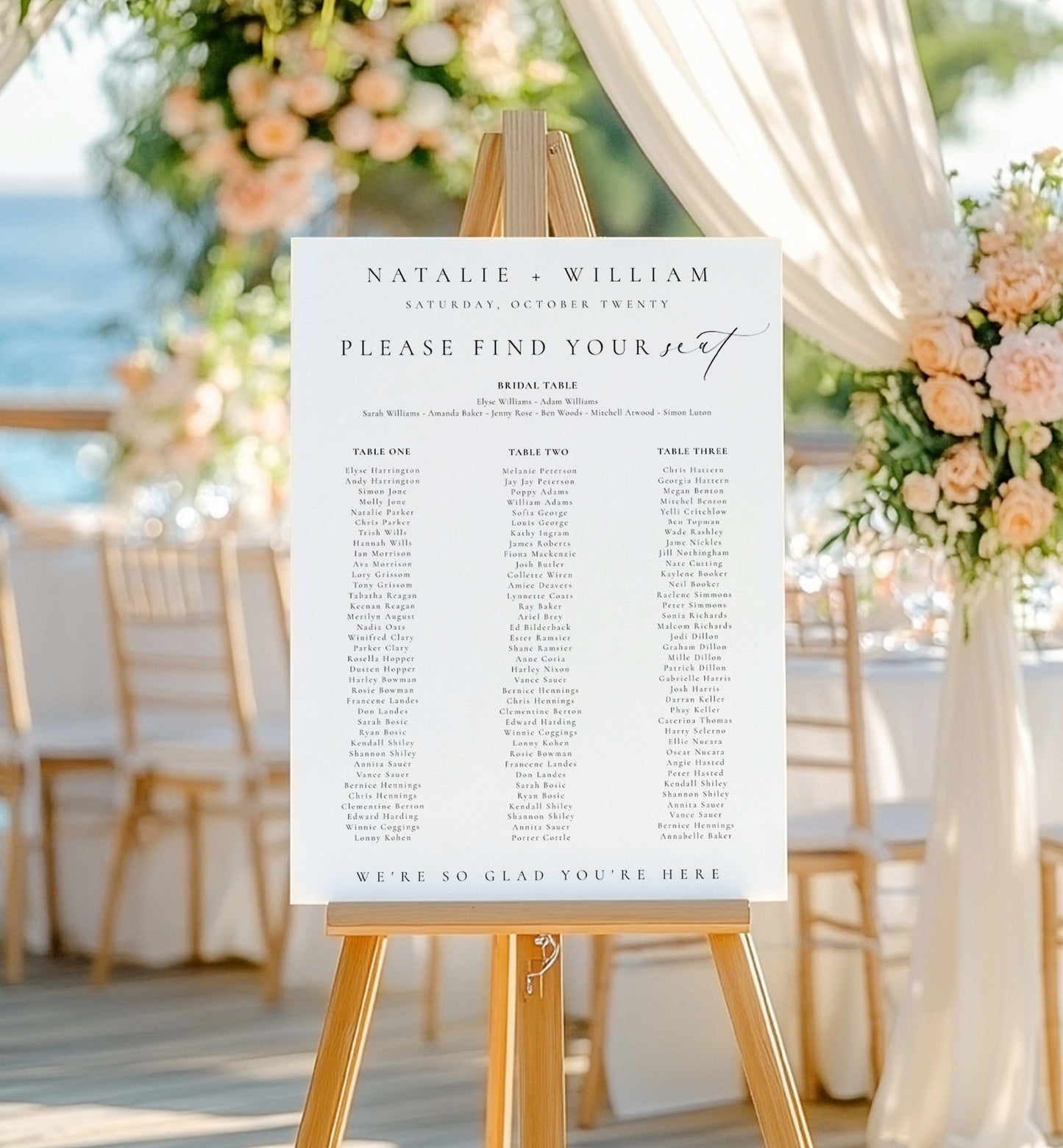 Wedding seating chart on an easel with floral decorations and tables in the background. Printable Wedding Table Plan Template, Minimalist Wedding Banquet Long Tables Seating Chart Template, Wedding Seating Plan Poster, Ellesmere