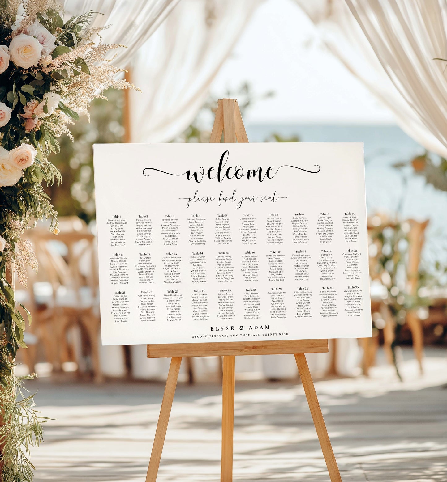 Seating chart sign on an easel with floral decorations and chairs in the background. Minimalist Wedding Seating Chart, Printable Modern Seating Chart Board, Simple Clean Wedding Seating Sign, Wedding Poster, 20 table seating chart, 30 table seating chart