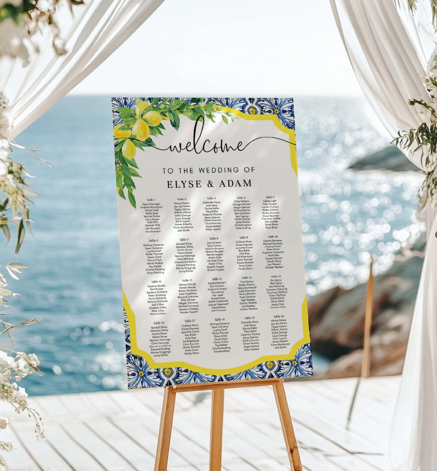 Wedding seating chart with floral design on a stand against a beach backdrop. Printable Seating Chart Template, Positano Blue Tile Lemon Wedding Table Plan, Italian Theme, Seating Plan Poster, Guest List Seating Sign