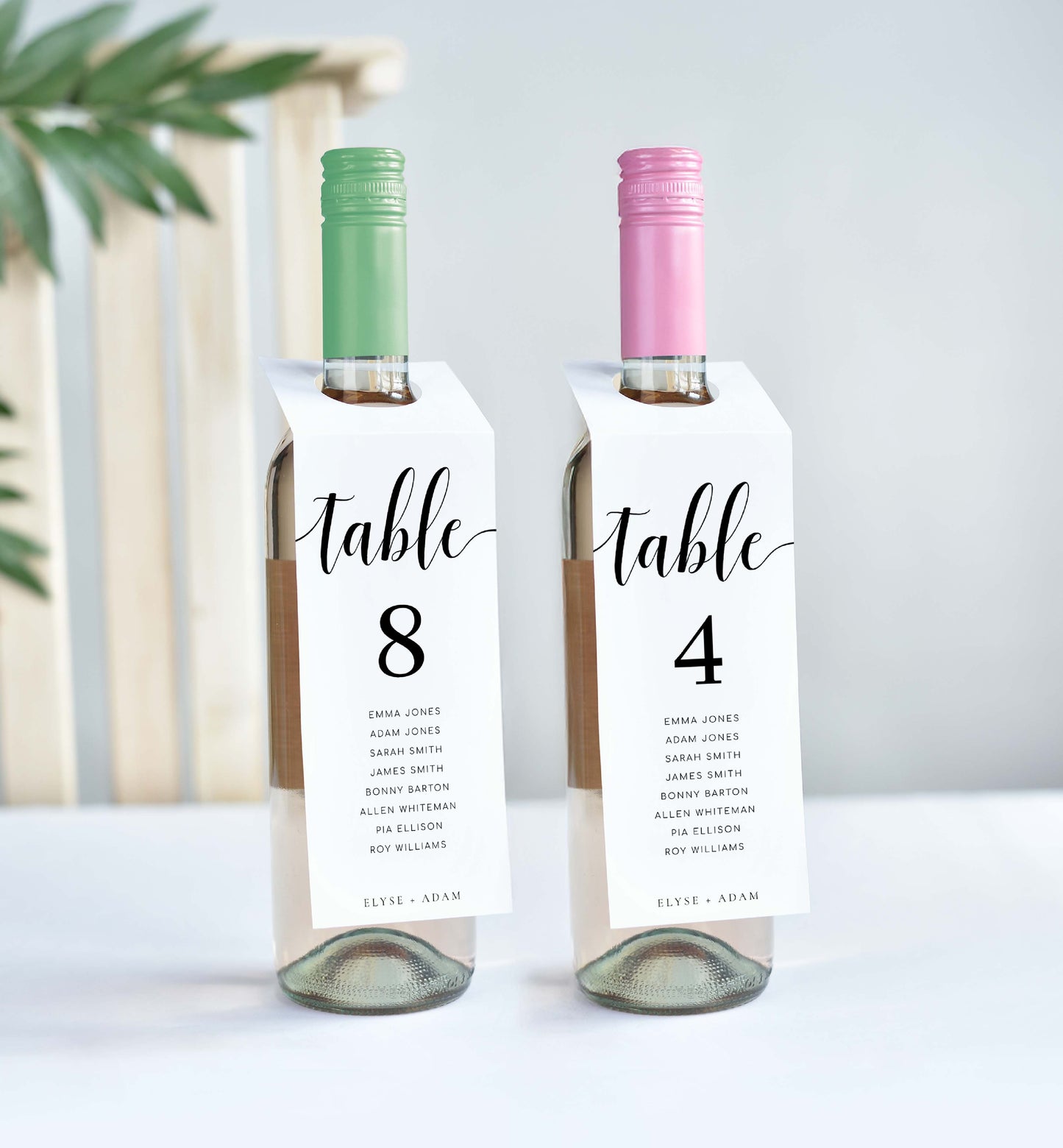 Two wine bottles with table number labels on a white background. Printable Table Number Wine Bottle Tags, Minimalist Wedding Table Numbers, Table Seating Plan Cards, Table Numbers with Guest Names, Leyton