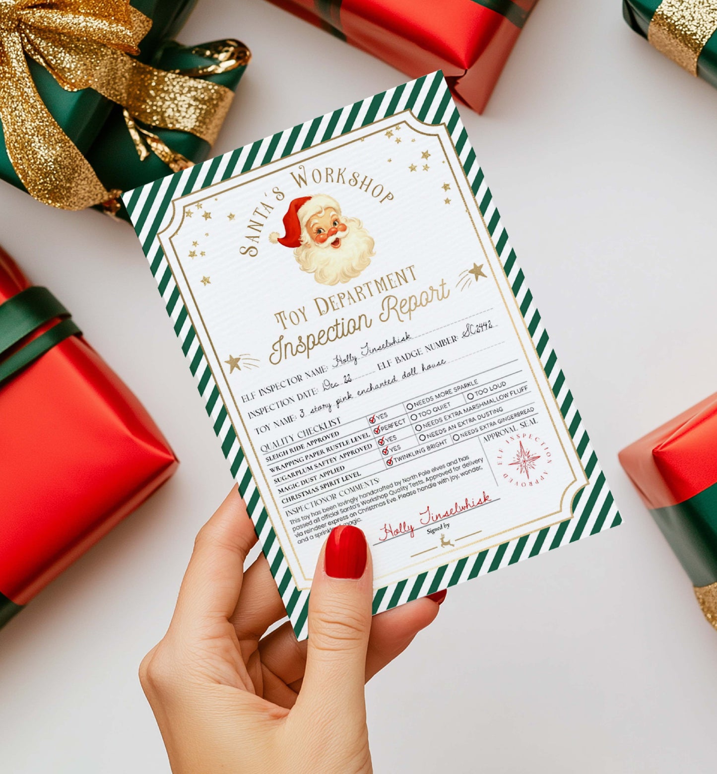 Hand holding a 'Toy Department Inspection Report' from Santa's Workshop with Christmas-themed. Printable Santa’s Workshop Toy Inspection Report, Christmas Gift Tag, From Santa Tag, Kid's Christmas Gift, Made In The North Pole, Stripe decorations.