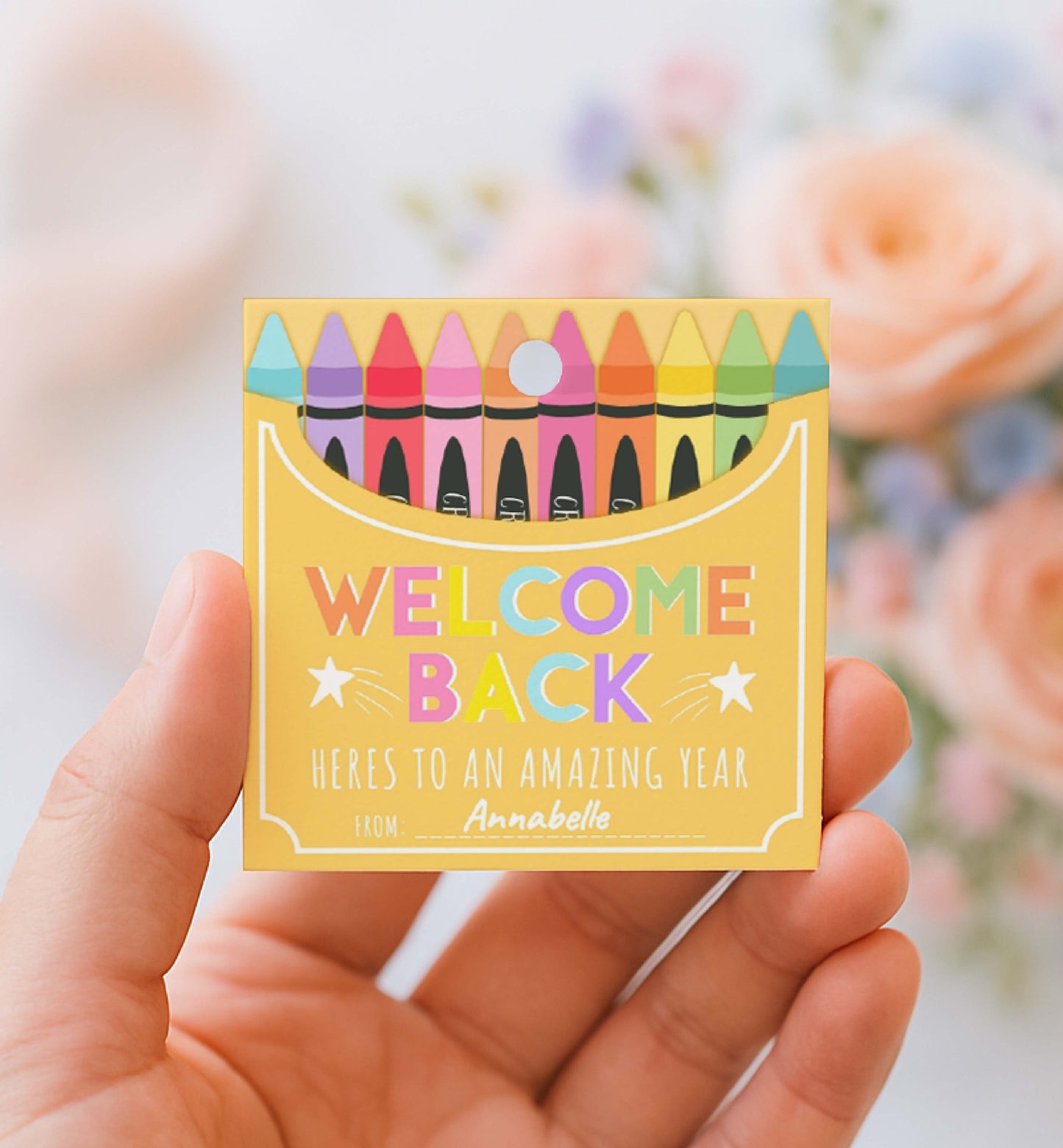 Hand holding a small box with colorful crayons and 'Welcome Back' text against a blurred floral background.
Printable Back To School Tag Template, Welcome Back To School Pencil Holder Tag, New School Year Classroom Gift, Crayon Gift
