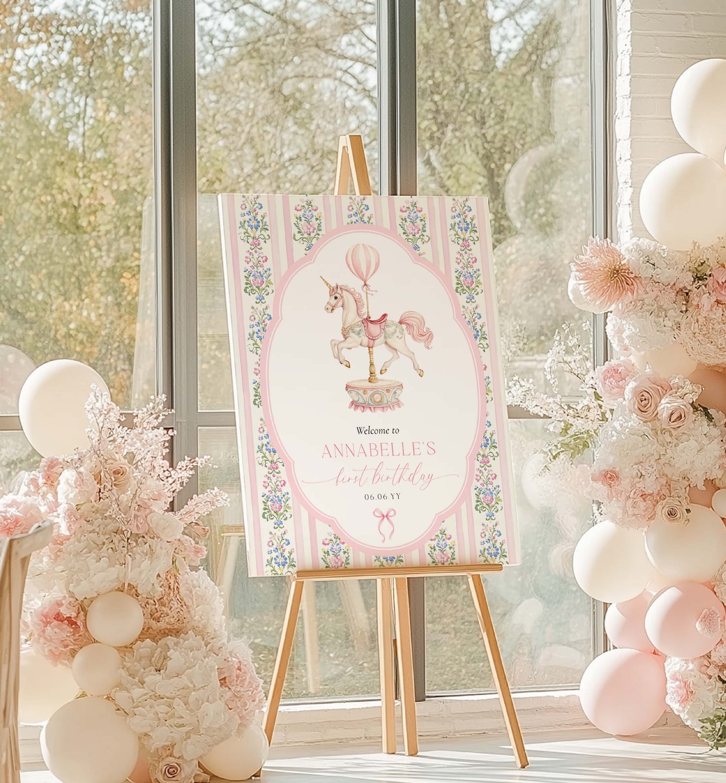 Decorative sign on an easel with floral and balloon design, surrounded by balloons and flowers in a bright room. Carousel Horse Welcome Sign, Printable First Birthday Welcome Sign, Girl First Birthday, Whimsical Pink Vintage Circus Unicorn Horse
