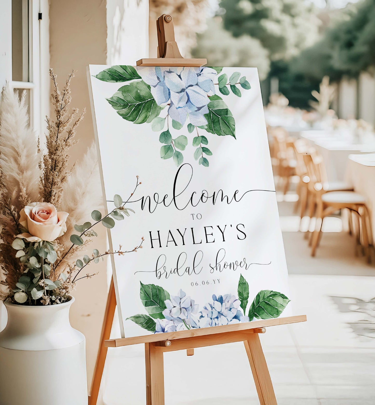 Welcome sign for Hayley's bridal shower with floral design on an easel outdoors. Printable Welcome Sign Template, Blue Hydrangea, Boy Baby Shower Welcome Sign, Bridal Shower Welcome Sign, Wedding Welcome Sign, Ferras