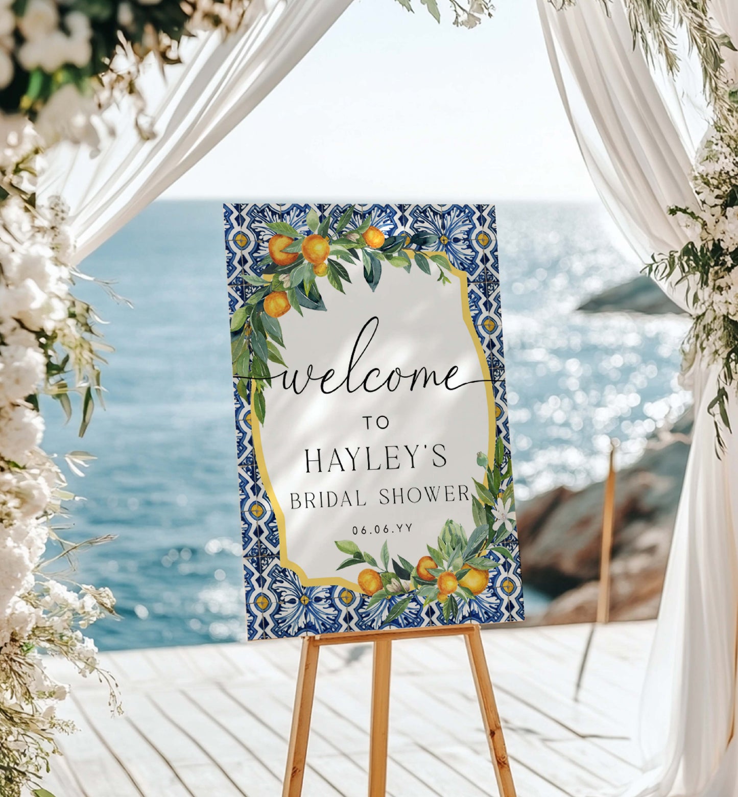 Decorative sign for a bridal shower with floral and fruit design, set against a scenic background. Printable Welcome Sign Template, Positano Blue Tile, Italian Oranges, Bridal Shower Welcome Sign, Wedding Sign, Baby Shower Sign