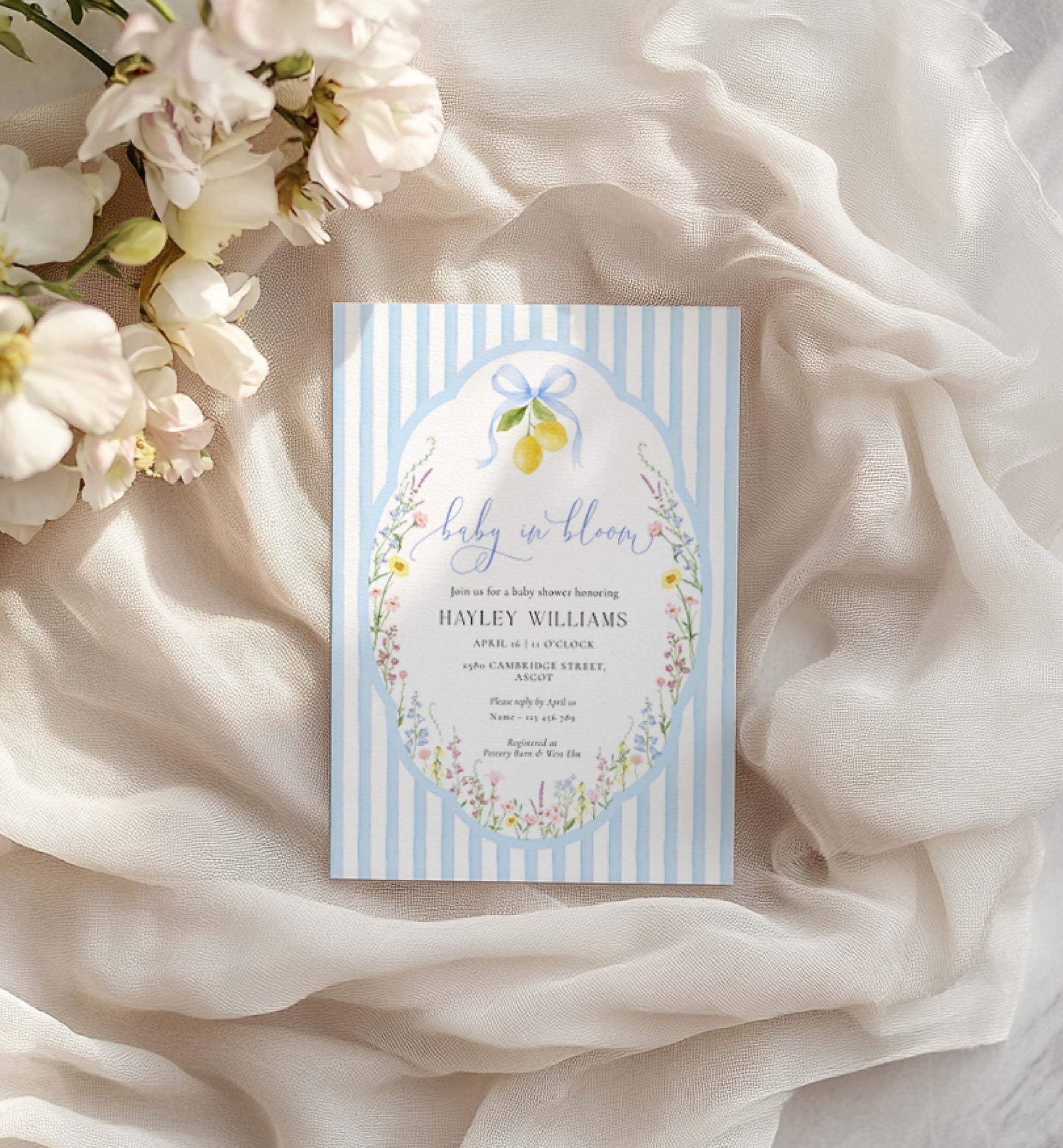 Baby shower invitation card with floral design on a soft fabric background. Printable Baby In Bloom Shower Invitation, Blue Bow, Spring Wildflower Floral, Boy Baby Shower Invite, Posey