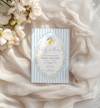 Baby shower invitation card with floral design on a soft fabric background. Printable Baby In Bloom Shower Invitation, Blue Bow, Spring Wildflower Floral, Boy Baby Shower Invite, Posey