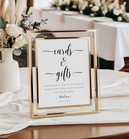 Gold-framed sign on a table with floral decorations, indicating a card and gift table for an event. Cards and Gifts Sign, Minimalist Wedding Present Table Sign, Printable Wedding Gifts Sign, Modern Baby Shower Cards & Gifts Sign, Leyton