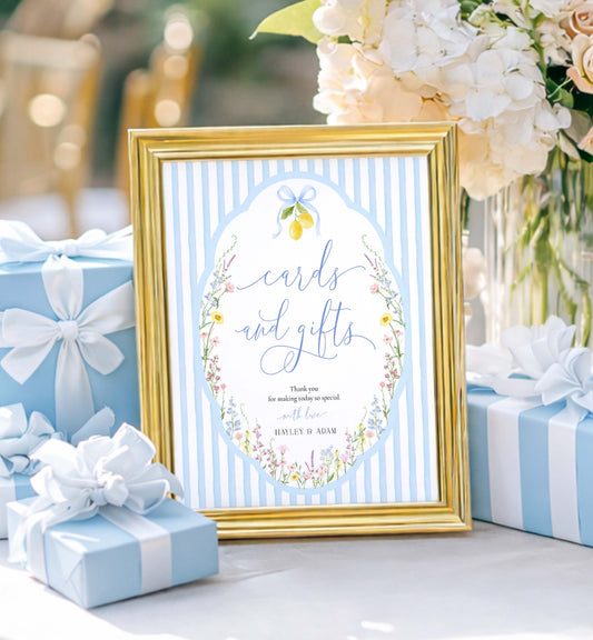Decorative sign with 'cards and gifts' text in a gold frame, surrounded by blue gifts and flowers. Printable Cards and Gifts Sign Template, Blue Bow Ribbon, Spring Wildflower, Baby Shower Present Table Sign, Bridal Shower Gift Sign, Posey