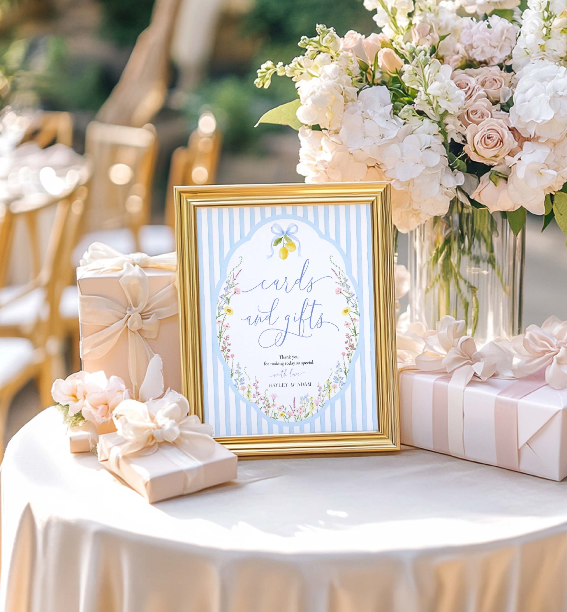 Decorative table setting with a 'Cards and Gifts' sign, flowers, and gift boxes. Printable Cards and Gifts Sign Template, Blue Bow Ribbon, Spring Wildflower, Baby Shower Present Table Sign, Bridal Shower Gift Sign, Posey