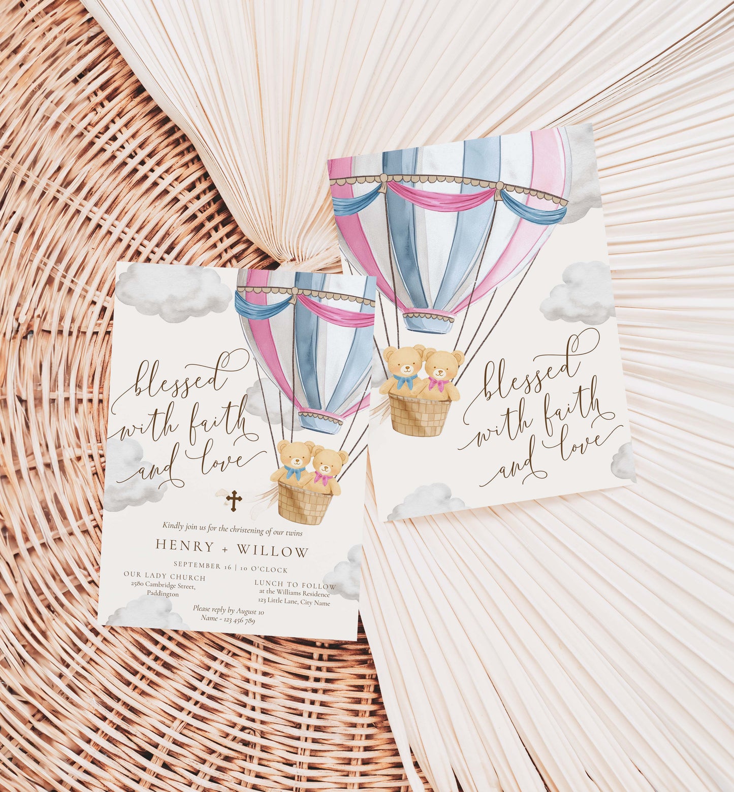 Two cards with hot air balloon designs and text on a woven surface. Twins Christening Printable Invitation Template: Pink & Blue Teddy Bear Hot Air Balloon, Boy/Girl Baptism