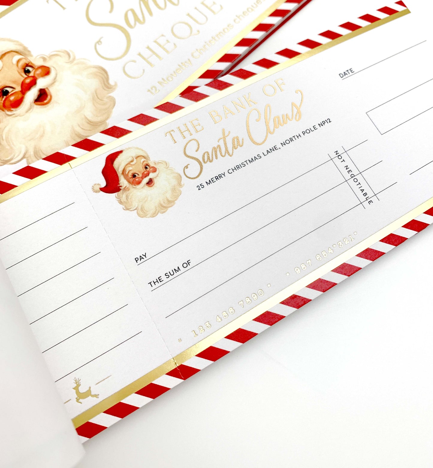 Christmas-themed checkbook cover with Santa Claus design. Bank Of Santa Claus Novelty Christmas Cheque Book, Christmas Gift Vouchers, Christmas Money Gift