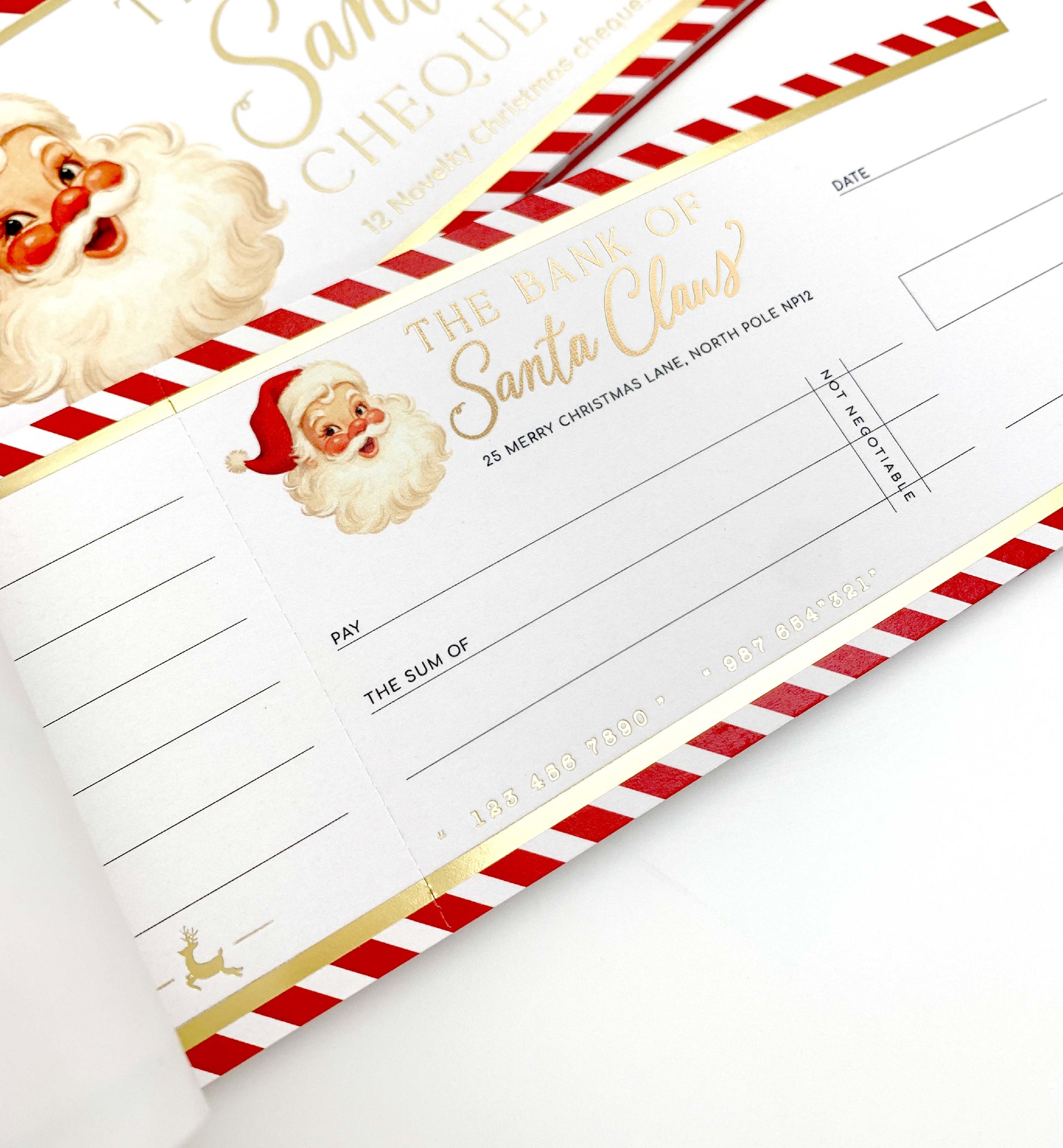 Christmas-themed checkbook cover with Santa Claus design. Bank Of Santa Claus Novelty Christmas Cheque Book, Christmas Gift Vouchers, Christmas Money Gift