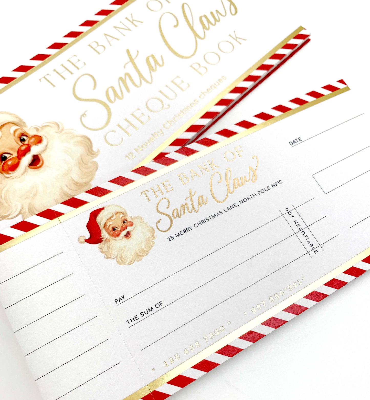 Cheque book cover with Santa Claus design and red and white striped border. Bank Of Santa Claus Novelty Christmas Cheque Book, Christmas Gift Vouchers, Christmas Money Gift