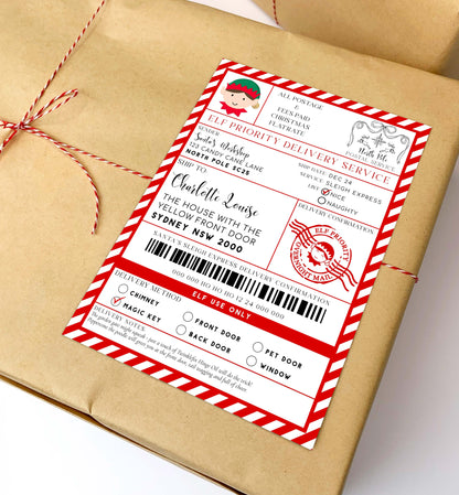 Gift wrap with a red and white label on a brown paper background. Printable Elf Arrival Box Shipping Label Sticker, North Pole Elf Mail Gift Tag, Santa's Workshop Christmas Special Delivery Shipping Label
