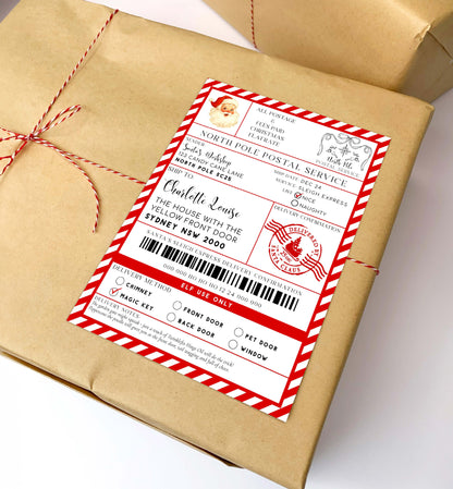 Gift box wrapped in brown paper with a red and white label on a white background. Printable Santa Mail North Pole Shipping Label Sticker, Christmas Special Delivery Shipping Label Template, Christmas Santa Gift Tag