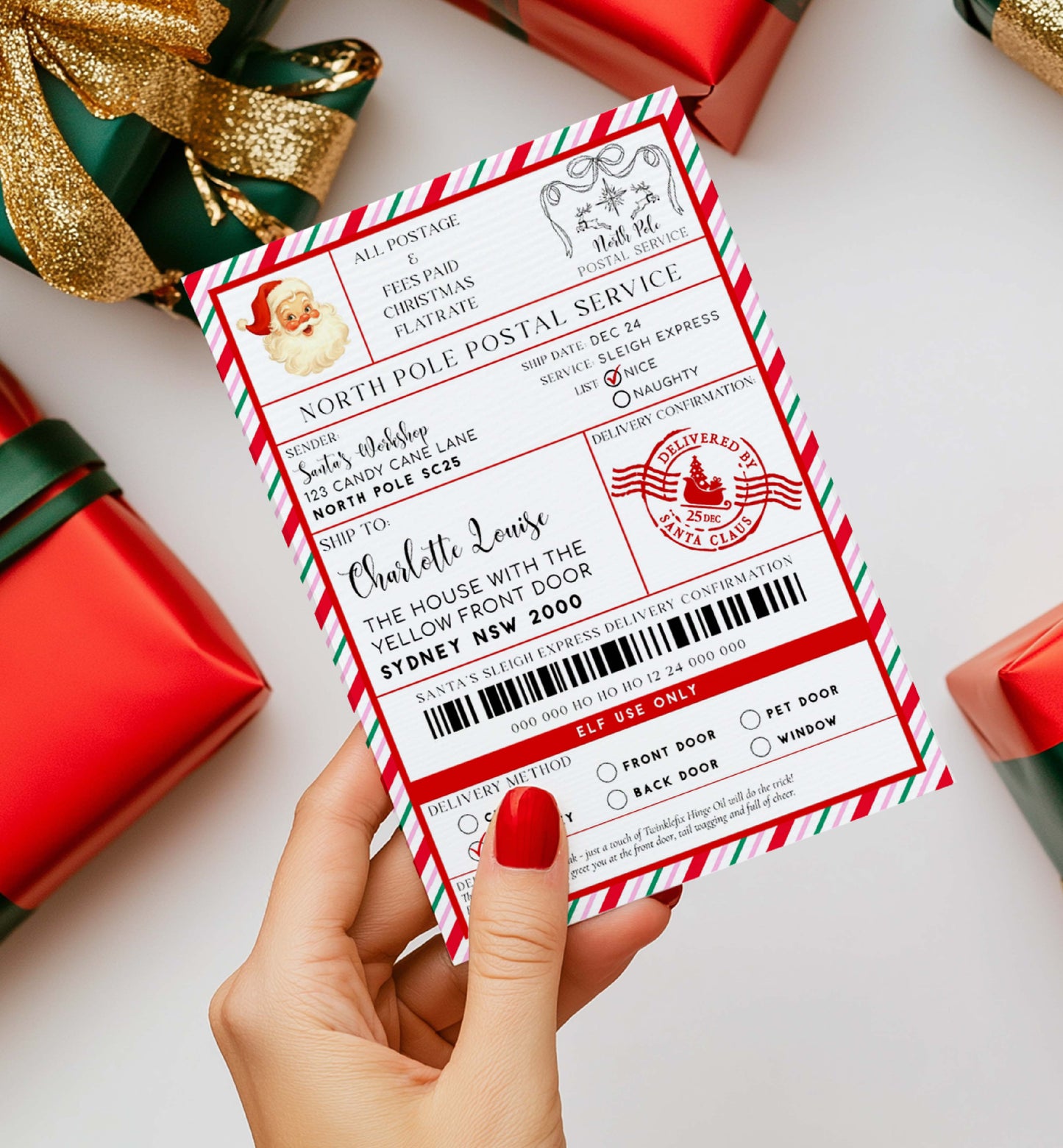 Hand holding a North Pole Postal Service ticket with Christmas-themed design, surrounded by gift boxes. Printable Santa Mail North Pole Shipping Label Sticker, Christmas Special Delivery Shipping Label Template, Christmas Santa Gift Tag