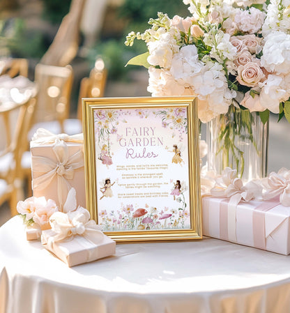 Decorative table setting with a fairy-themed sign, flowers, and gifts. Fairy Garden Rules Sign Printable, Girls Fairy Birthday Party Decoration Sign