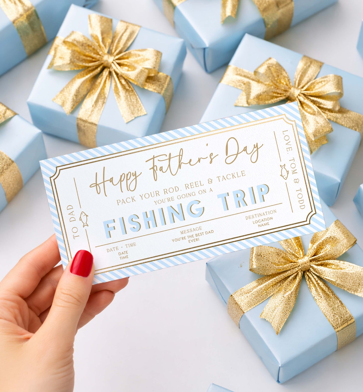 Gift card for a fishing trip held over wrapped gifts with gold bows on a light background. Printable Father's Day Fishing Trip Gift Voucher, Editable Surprise Experience Card