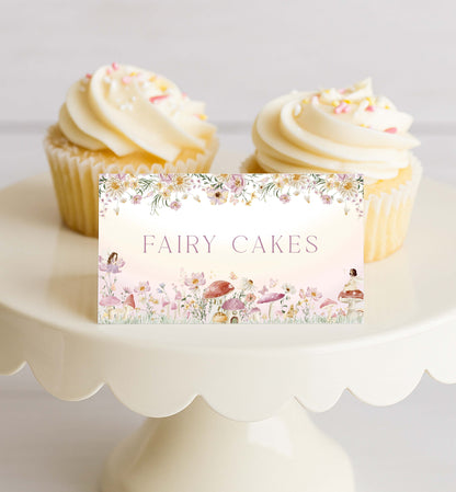 Two fairy cakes on a white cake stand with a decorative sign reading 'Fairy Cakes'. Fairy Party Printable Food Labels, Fairy Princess Birthday Tent Food Labels, Fairy Garden Tea Party, Flat and Tent Place Card Template