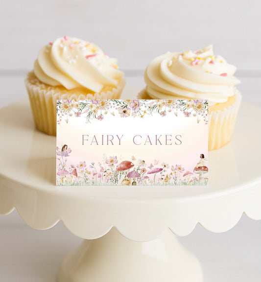 Two fairy cakes on a white cake stand with a decorative sign reading 'Fairy Cakes'. Fairy Party Printable Food Labels, Fairy Princess Birthday Tent Food Labels, Fairy Garden Tea Party, Flat and Tent Place Card Template
