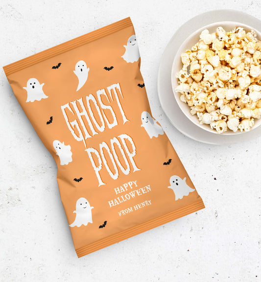Halloween-themed popcorn bag with ghost design and a bowl of popcorn on a white surface. Ghost Poop Popcorn Bag Wrapper, Printable Halloween Trick Or Treat Gift, Classroom Halloween Gift, Halloween Popcorn Bag Wrapper