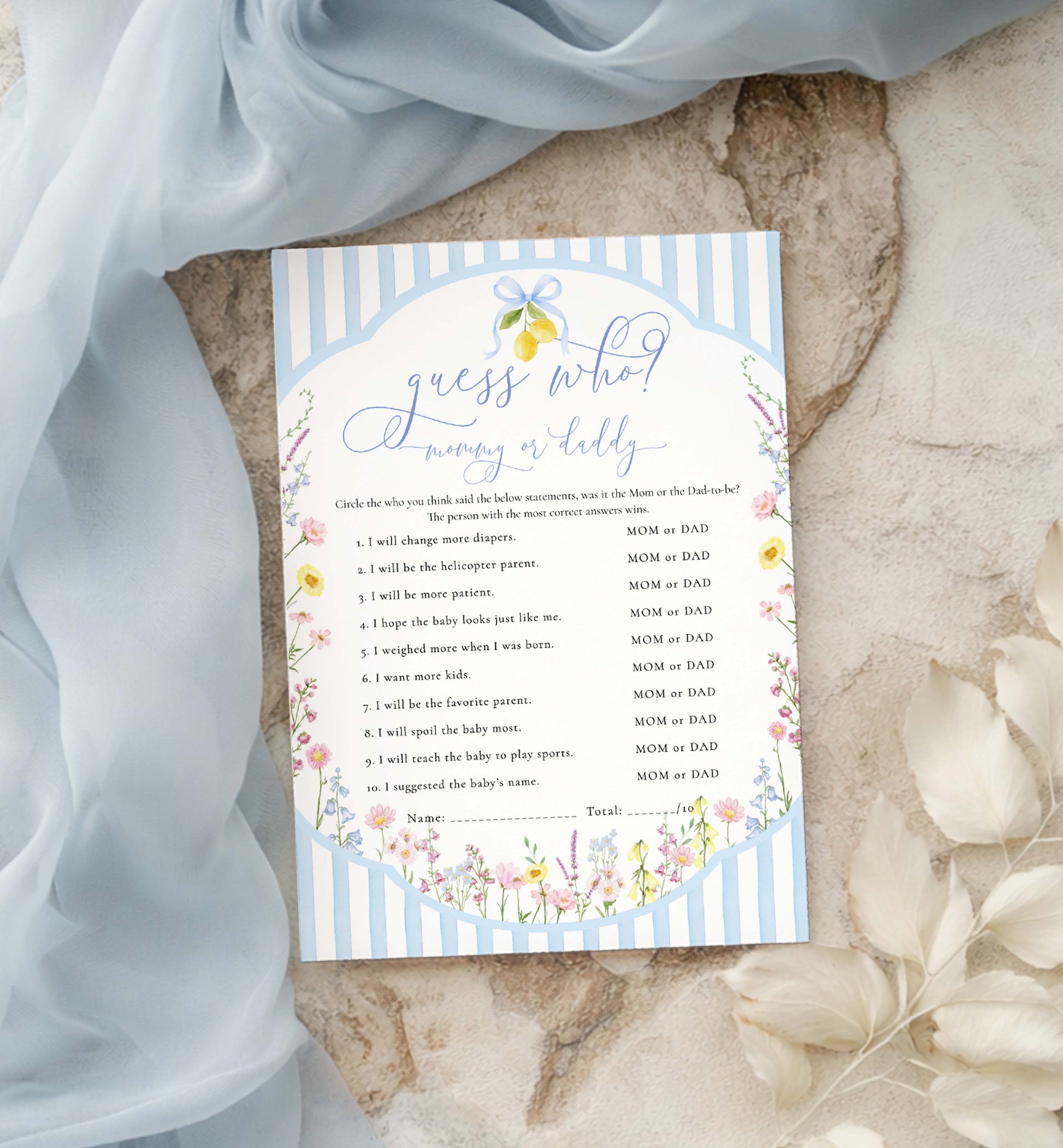 Baby shower game card with floral design on a textured surface. Printable Guess Who Mom or Dad Game, Blue Bow Spring Wildflower Baby Shower Guess Who Said It Game, He Said She Said, Posey