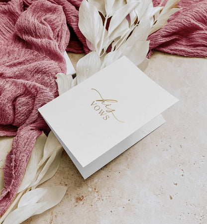 White card with 'Thanks' in gold on a textured surface with pink fabric and white flowers. His And Her Vow Books, Off White Gold Foil, Bride and Groom Wedding Day Card, Minimalist Wedding Vows Card, Wedding Ceremony Card, Ellesmere