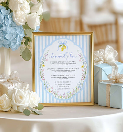 Framed lemonade menu with floral design on a table with flowers and gift boxes. Printable Lemonade Bar Sign, Blue Bow Ribbon, Bridal Shower Cocktail Menu, Wedding Bar Sign, Italian Lemons, Baby Shower Mocktail, Posey