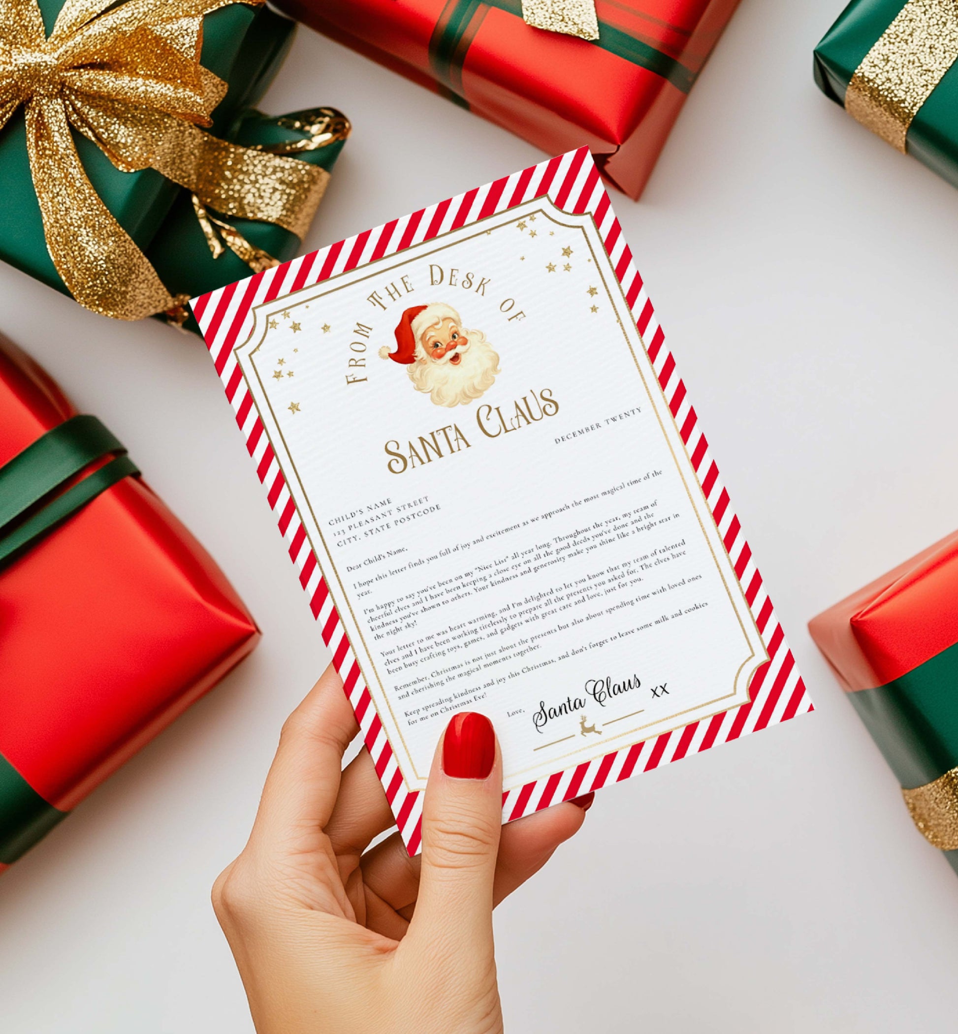 Letter from Santa Claus held by a hand with Christmas presents in the background. Printable Letter From Santa Template, Approved Nice List Member Letter From Santa Claus, Christmas Letter From Santa, Stripe Red