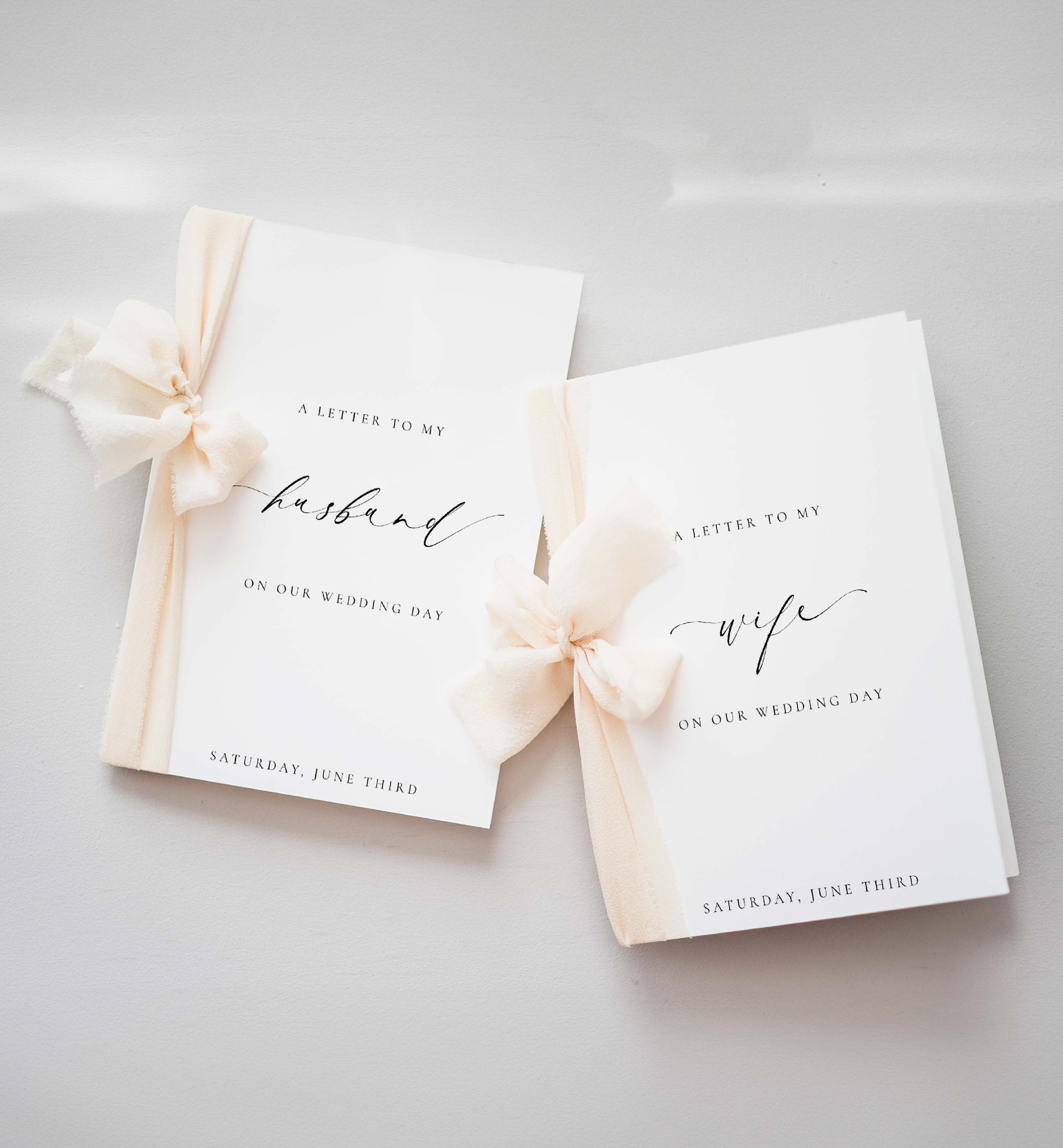 Two wedding day letter books with ribbons on a light gray background. Printable Wedding Vow Books, A Letter To My Husband Wedding Day Card Template, Minimalist Wedding, Bride and Groom Vows Card, Ellesmere