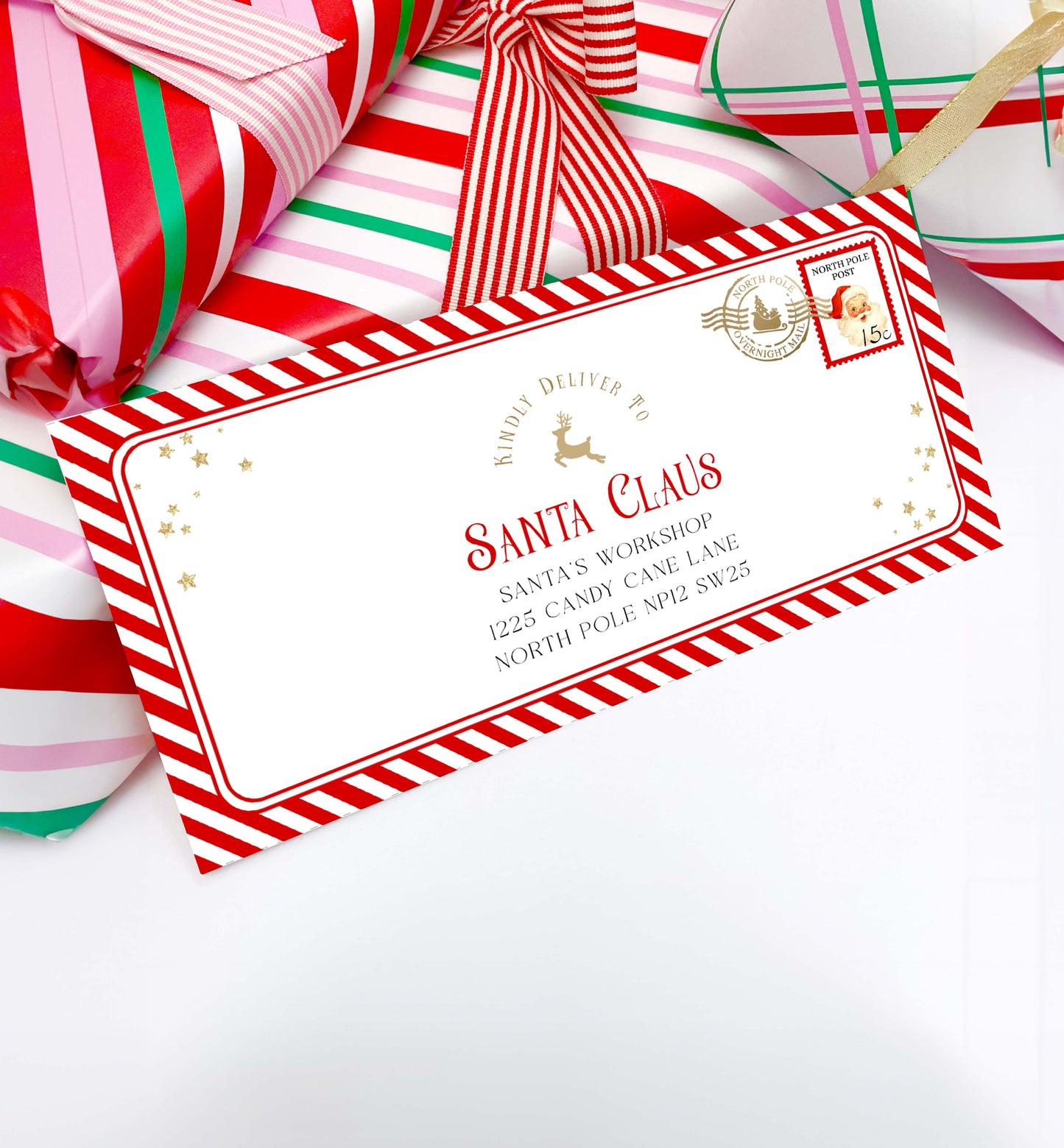 Decorative envelope with Santa Claus address on a white background with candy canes. Printable Letter To Santa Envelope, Santa North Pole Mail Envelope Template, Christmas Eve Box Santa Letter, Red Stripe