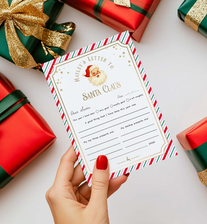 Hand holding a letter to Santa Claus with Christmas presents in the background. Printable Letter To Santa Template, Christmas Eve Mail for Kids, Children's Christmas Wish List, Dear Santa Christmas Letter, Stripe Pink