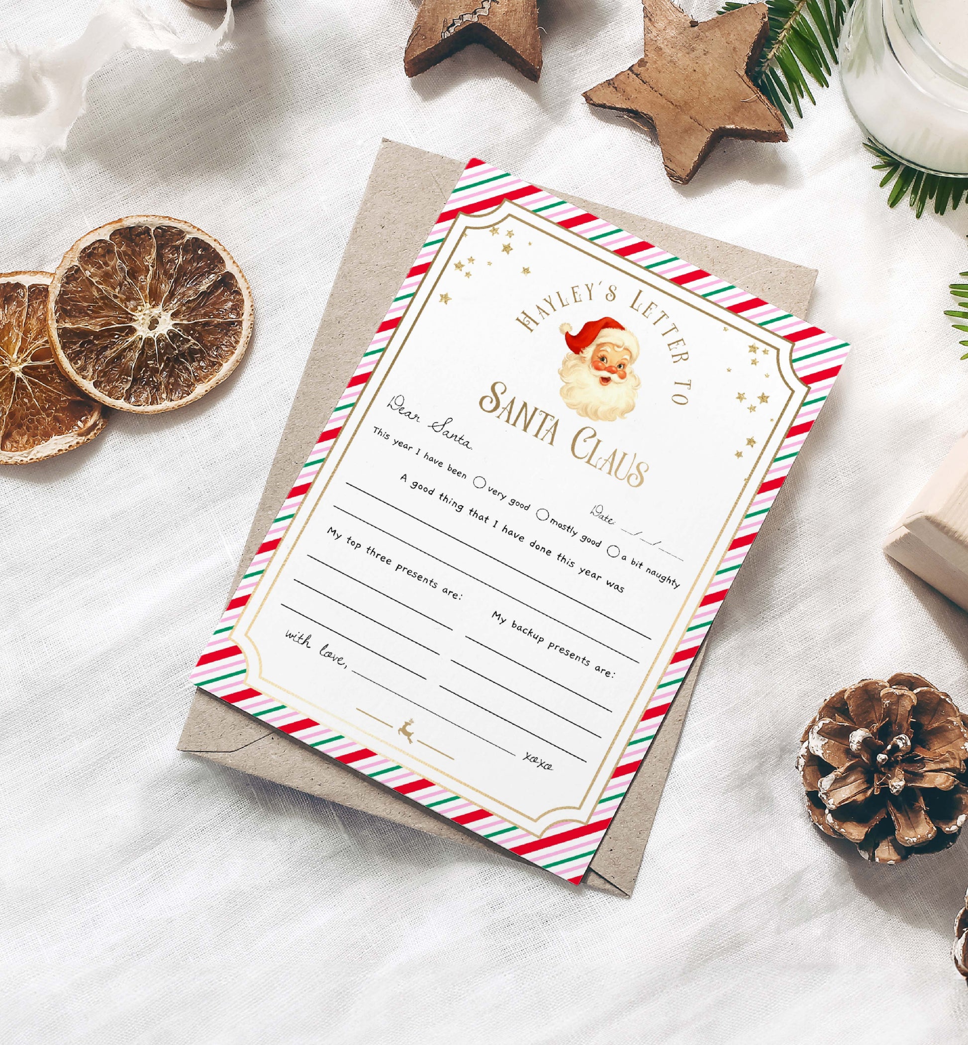 Letter to Santa Claus with decorative envelope on a white surface with Christmas elements. Printable Letter To Santa Template, Christmas Eve Mail for Kids, Children's Christmas Wish List, Dear Santa Christmas Letter, Stripe Pink
