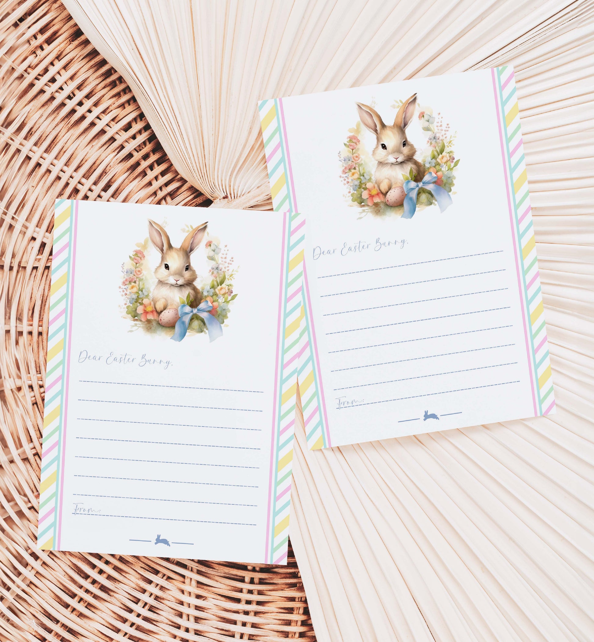 Two Easter-themed notepads with bunny illustrations on a woven surface.