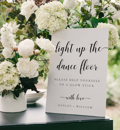 Decorative sign with floral arrangement on a table Printable Wedding Glow Stick Sign, Minimalist Wedding Light Up The Dance Floor Sign, Editable Let Love Glow Sign Template, Leyton