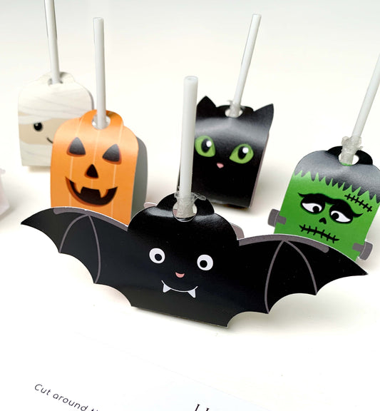 Halloween-themed treat holders shaped like a bat, cat, and monster on a white background. Printable Halloween Lollipop Tags Template, Halloween Trick or Treat Sucker Tag, Kids Classroom Halloween, Friends Halloween Gift